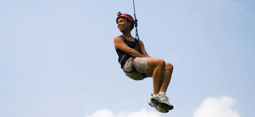 learning trust, suspended in a climbing harness