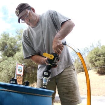 Scott collecting vegetable oil for fuel