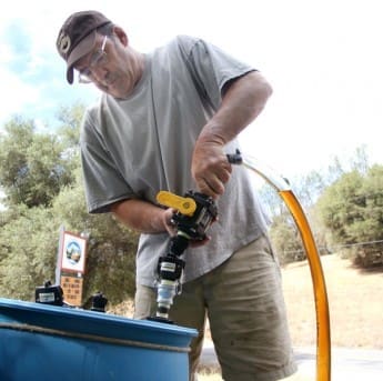 Scott collecting vegetable oil for fuel